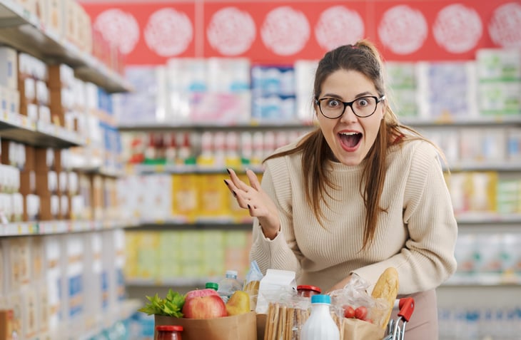 Excited and happy shopper at the grocery store