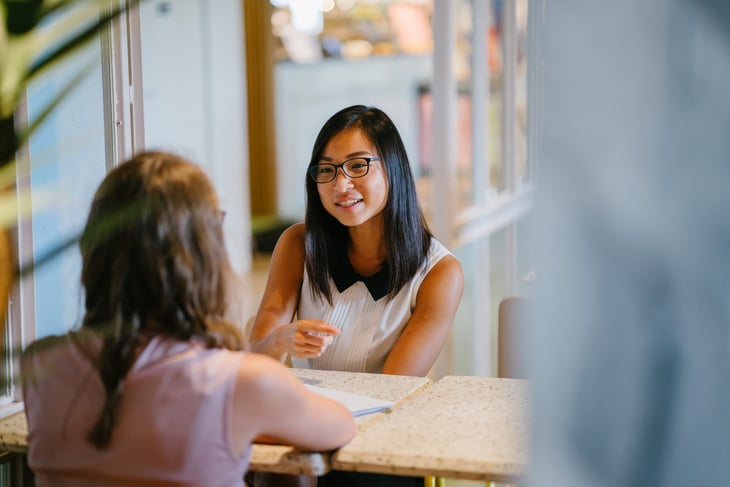 two women meet in a professional job interview