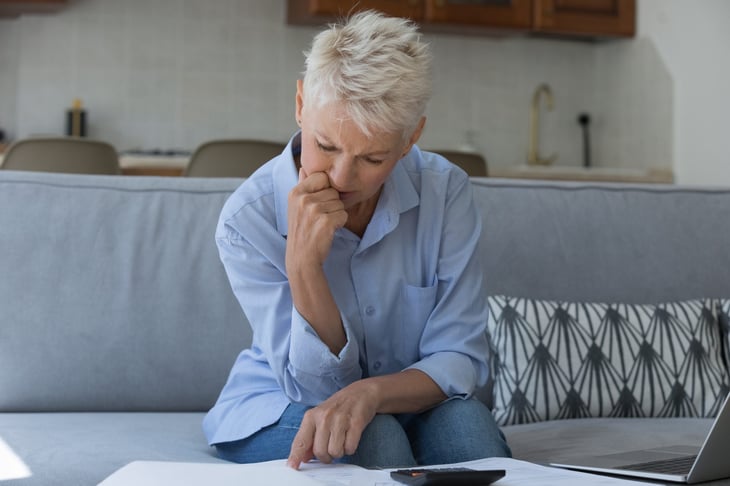 Senior woman weighing whether to file for Social Security